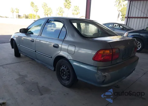 1999 Honda Civic Lx z USA, uszkodzony, nr VIN 2HGEJ6673XH568115